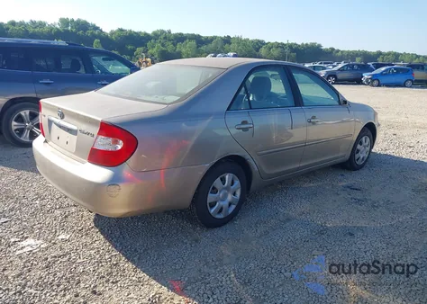 2003 Toyota Camry Le z USA, uszkodzony, nr VIN JTDBE32K130239667